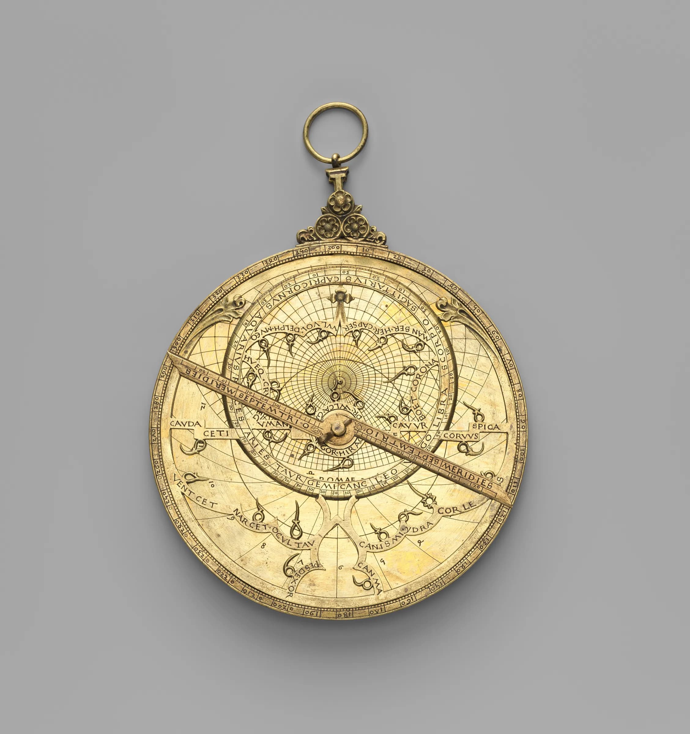 An astrolabe made in 1462 for Cardinal Bessarion — a brass disc engraved with sky-tracking marks and constellation figures, with a rotating rule across its face.